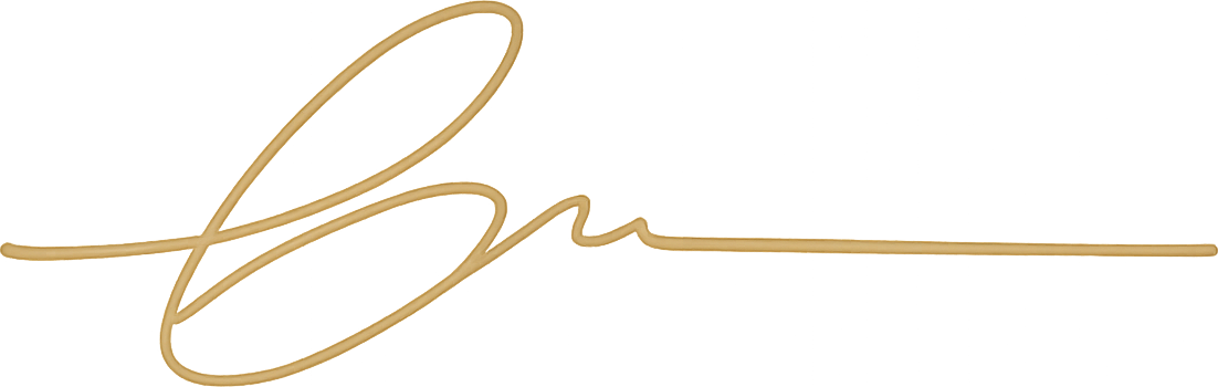 Founder’s signature in muted gold.